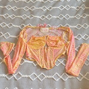 New Pink from Dolls Kill pink & yellow animal print corset top. Runs small